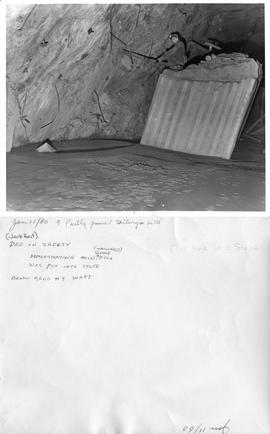 Jan 11/60 a partly poured tailings fill - (Jack Heit) Dad on safety demonstrating how fill was pu...